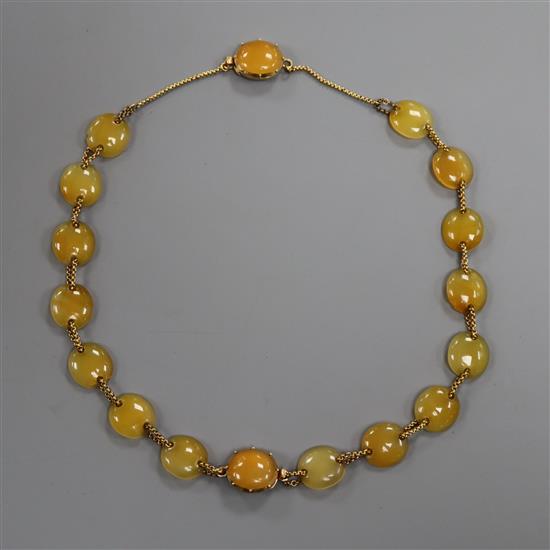 An Edwardian yellow metal and yellow agate choker necklace, which converts into two bracelets, overall length 37cm.